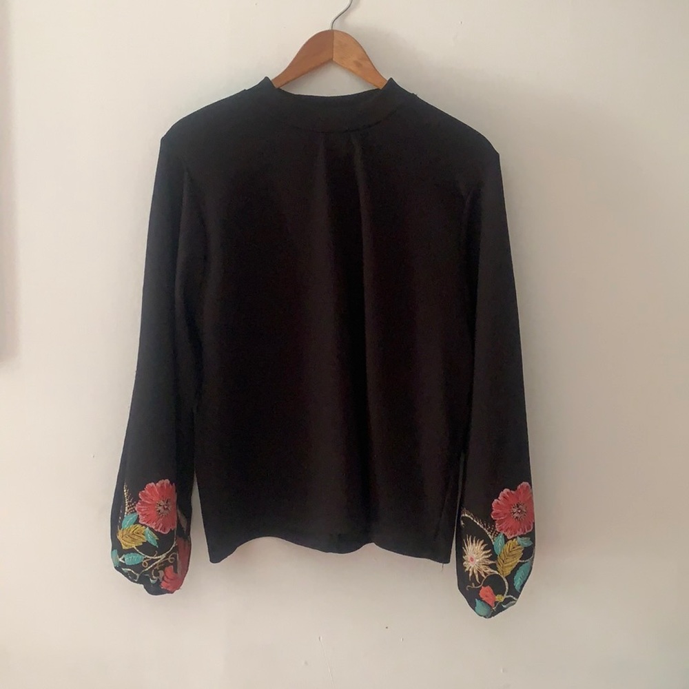 black Zara top with stitched flowers on sleeves